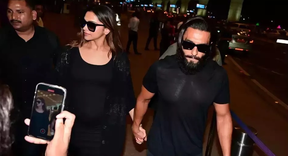 Ranveer Singh's Tender Moment: Refuses to Let Go of Pregnant Deepika Padukone's Hand at the Airport