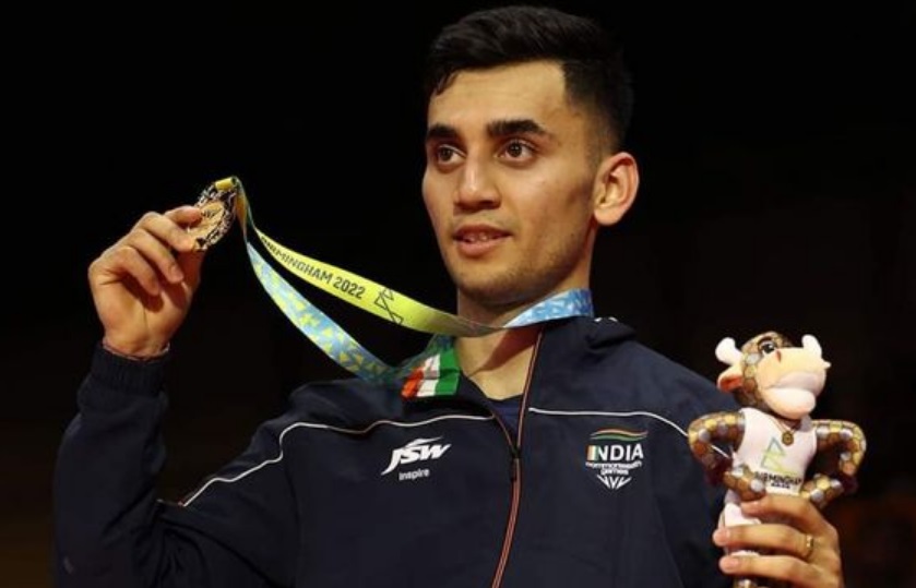 India's Lakshya Sen hits a shot against Guatemala's Kevin Cordon.