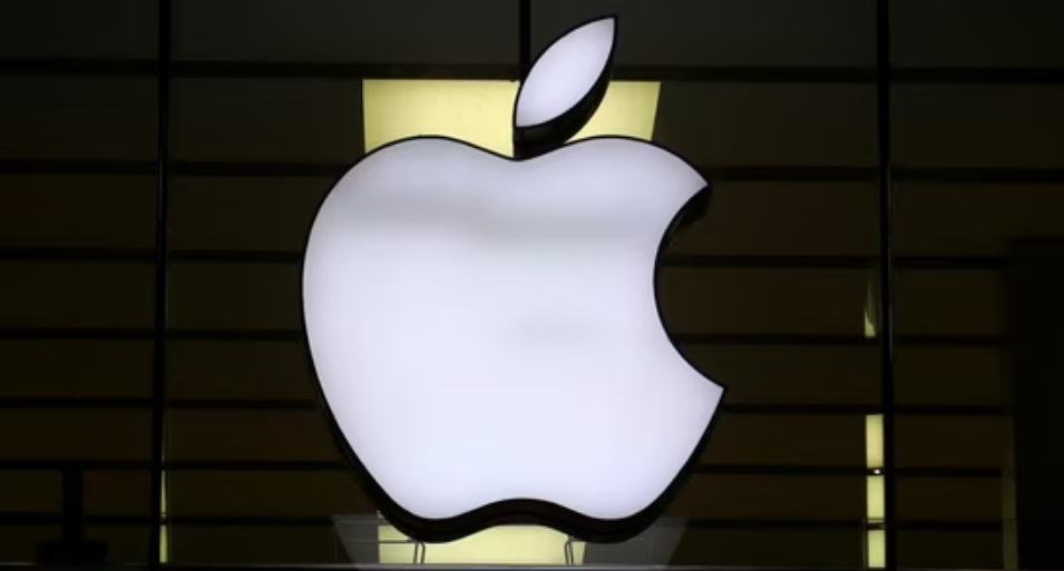 The Apple logo is illuminated at a store in the city center in Munich, Germany.