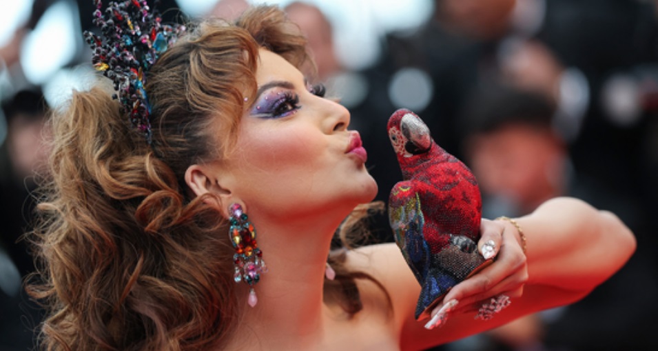 Urvashi Rautela Stuns at Cannes with ₹4 Lakh Parrot Clutch; Internet Reacts: ‘Moulin Rouge Meets Mayur Vihar’