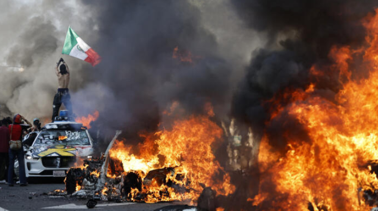 Chaos in Los Angeles: Protesters Set Cars Ablaze, Shut Down Major Freeway